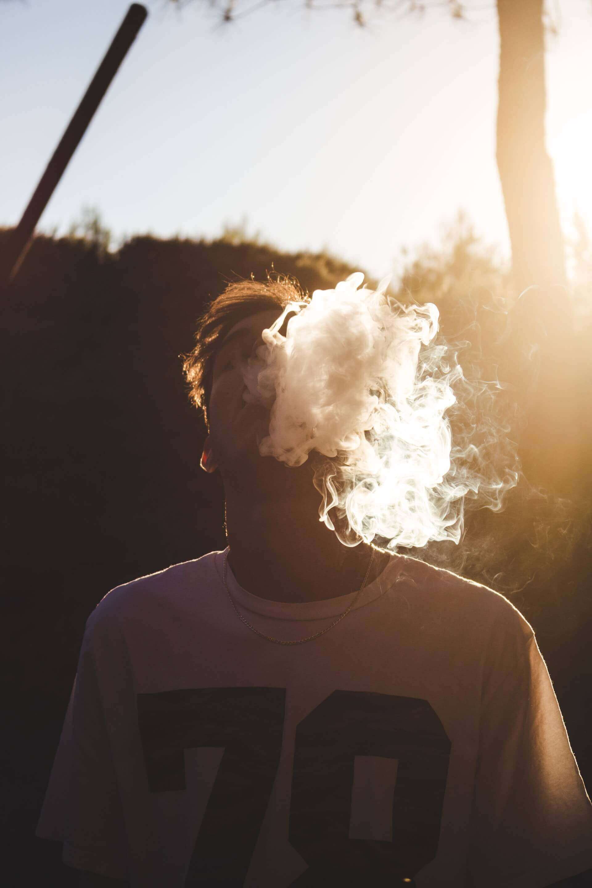 young guy smoking herbs